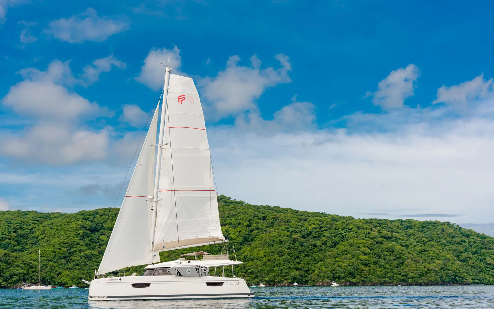 Endeavour, an Ocean Club sailing catamaran under full sail off Guanacaste, Costa Rica