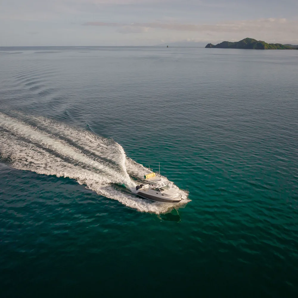 Aerial view of an Ocean Club fishing boat under way on Costa Rica's Pacific coast