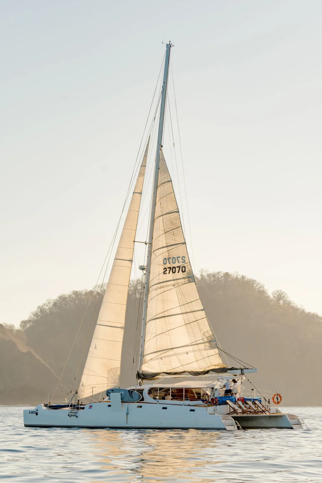 Lohe Lani sailing on flat water in late afternoon light