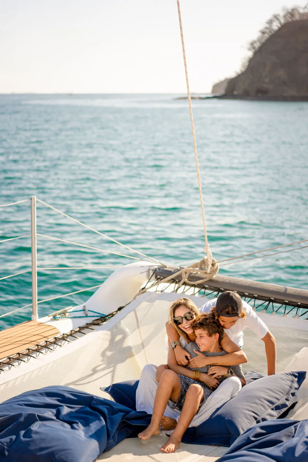 Guests stretched out on beanbags on Lohe Lani's foredeck trampolines