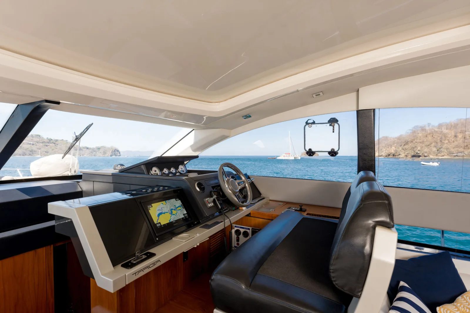 Samia's helm station, with wood joinery and twin helm seats