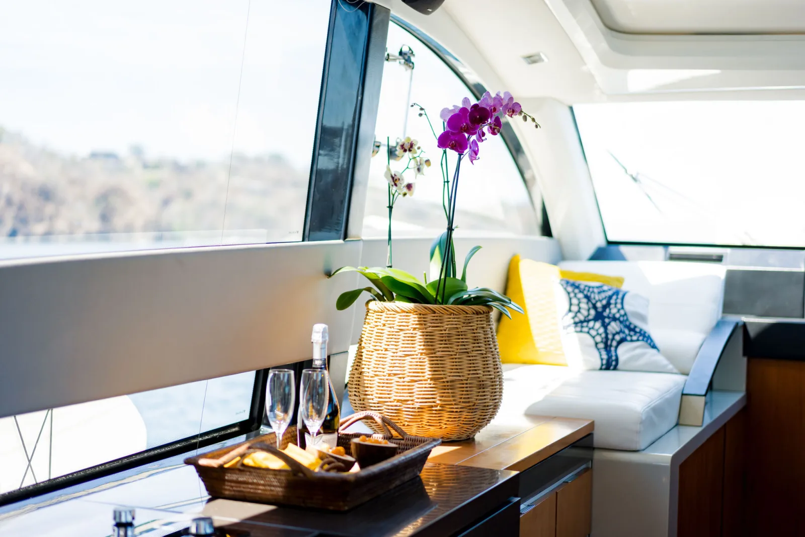 The air-conditioned salon aboard Samia, looking out through full-height windows