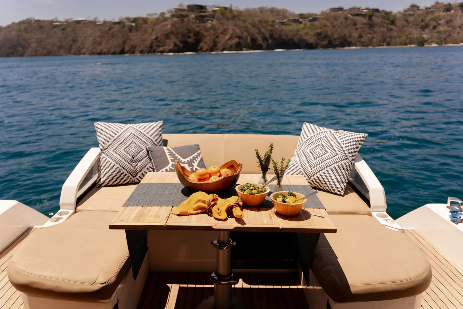 Samia's aft deck set for lunch, looking back over the water