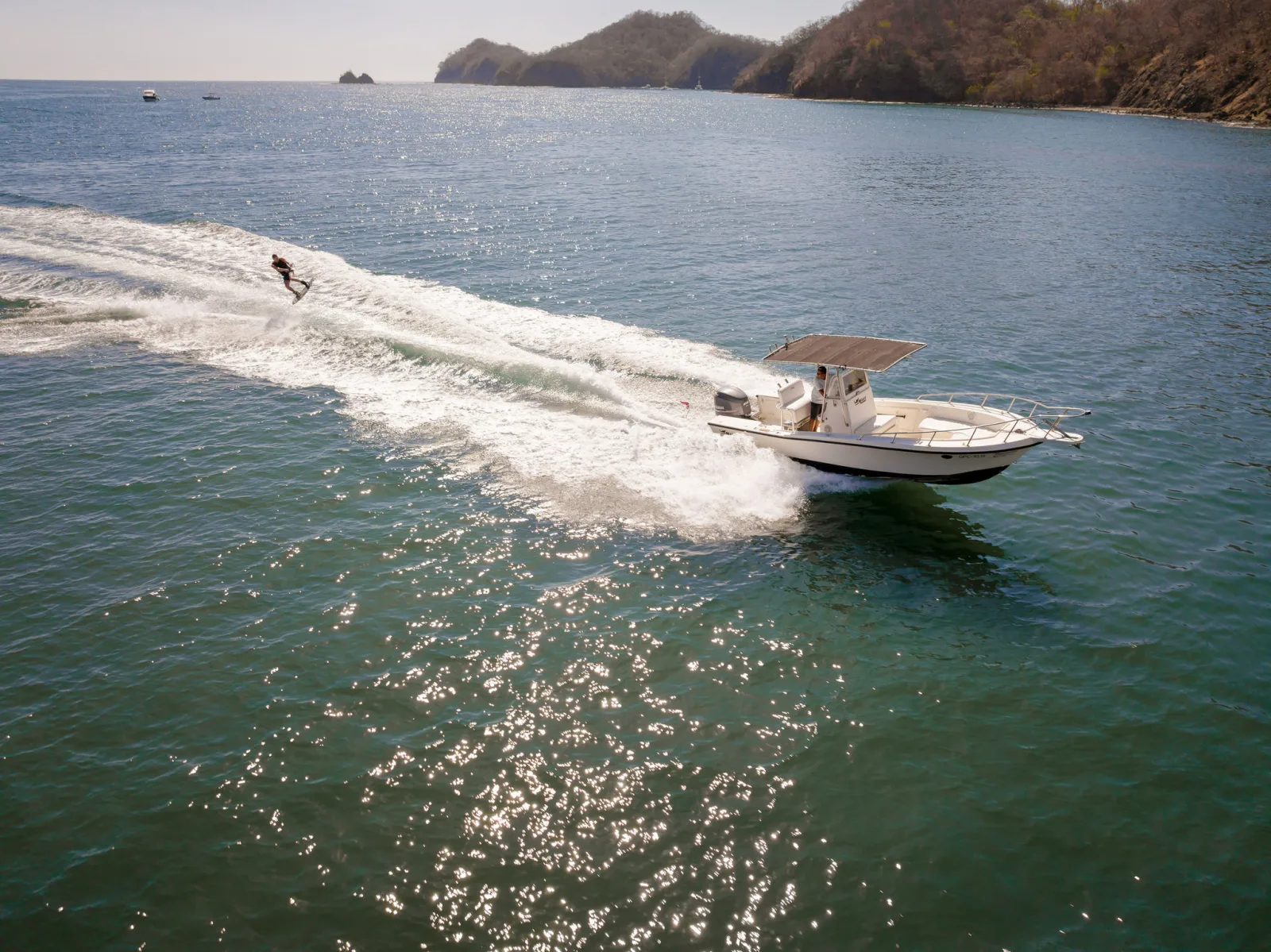 A water-skier behind the tender, seen from above