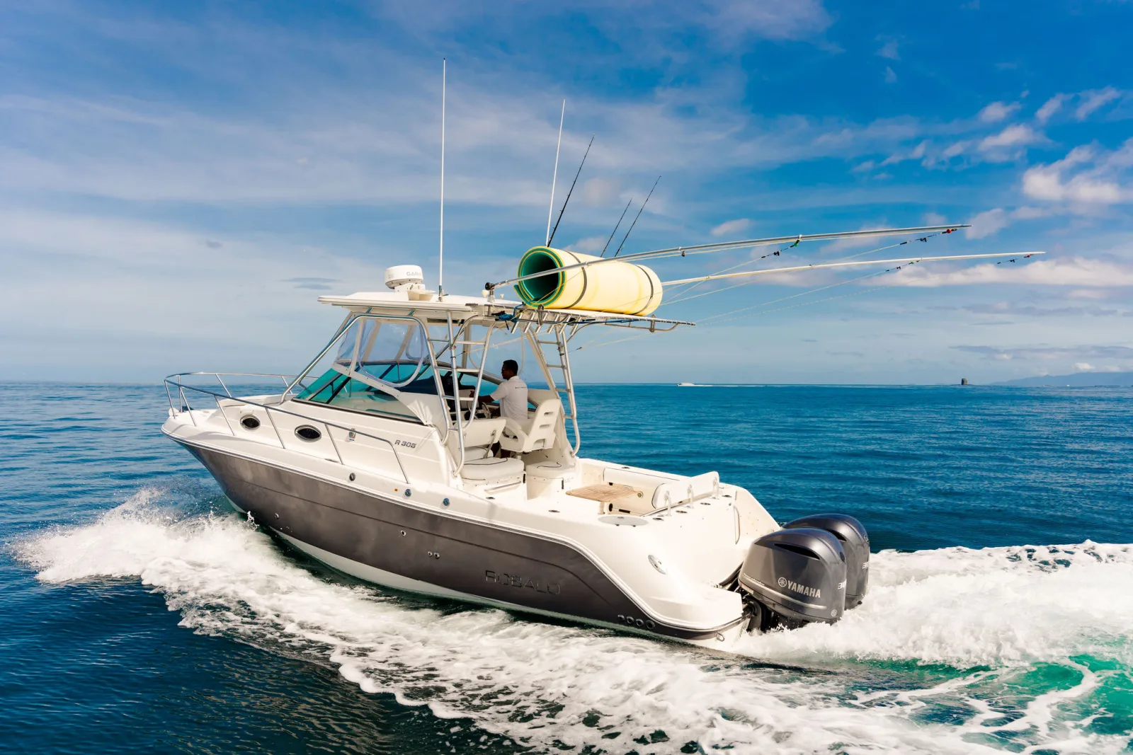 XQ seen bow-on, T-top and console against a bright sky